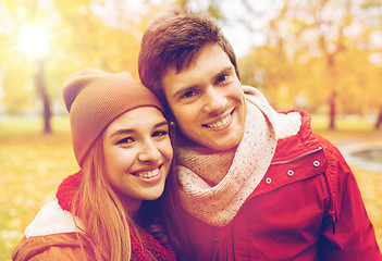 Image showing happy young couple walking in autumn park