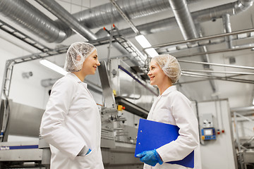 Image showing happy women technologists at ice cream factory