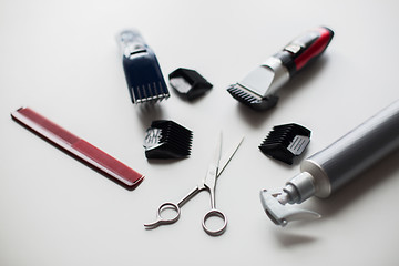 Image showing styling hair sprays, clippers, comb and scissors