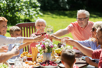 Image showing happy family having dinner or summer garden party