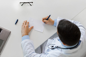 Image showing doctor hands with prescription at clinic