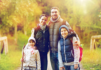 Image showing happy family with backpacks hiking