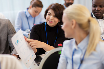 Image showing business people at conference with papers