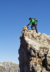 Image showing Tourist on a cliff