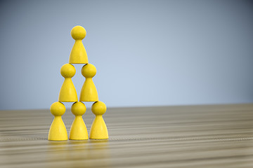 Image showing game figures building a pyramid