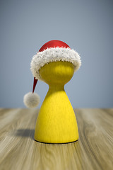 Image showing a red christmas hat on a yellow game figure