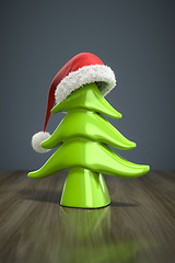 Image showing a red christmas hat on a green tree