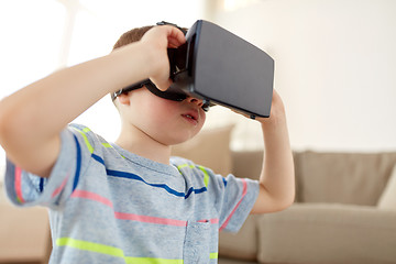 Image showing little boy in vr headset or 3d glasses at home