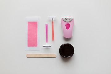 Image showing hair removal wax, epilator and safety razor