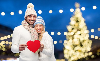 Image showing couple with red hearts over christmas lights