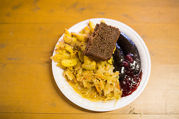 Image showing braised cabbage and sausages with sauce on plate