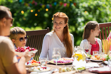 Image showing happy family having dinner or summer garden party