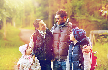 Image showing happy family with backpacks hiking