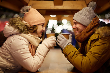 Image showing happy young couple with coffee at christmas market