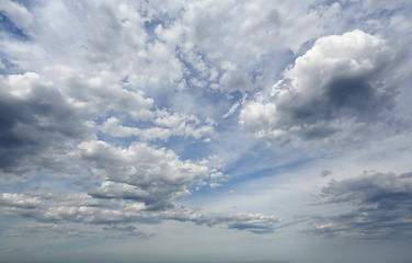 Image showing Sheer high cloud mixed with heavy darker clouds with blue sky