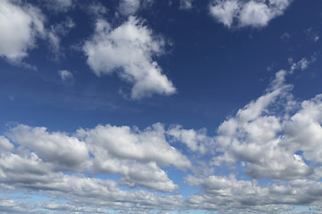 Image showing Blue skies with white puffy clouds