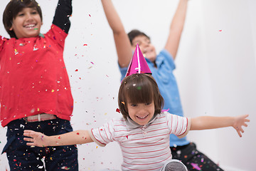 Image showing kids  blowing confetti