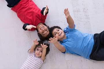 Image showing young boys having fun on the floor