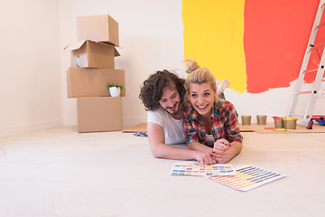 Image showing Happy young couple relaxing after painting