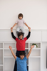 Image showing young boys posing line up piggyback