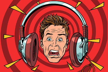 Image showing A scared man wearing headphones