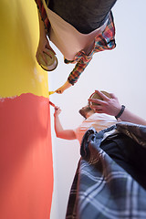 Image showing couple painting interior wall