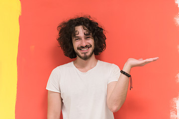 Image showing young man with funny hair over color background