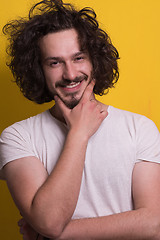 Image showing young man with funny hair over color background