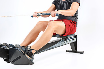 Image showing Man Using A Press Machine In A Fitness Club.