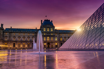 Image showing View of famous Louvre Museum with Louvre Pyramid at evening. 