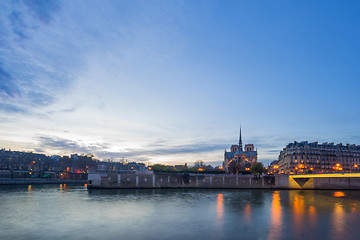 Image showing Notre Dame Cathedral with Paris cityscape at dus