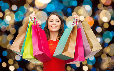 Image showing happy woman with colorful shopping bags