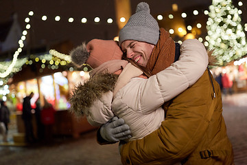 Image showing happy couple hugging at christmas tree