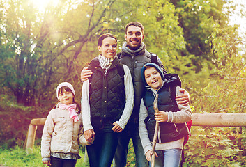 Image showing happy family with backpacks hiking