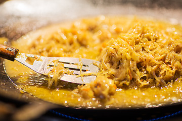 Image showing braised cabbage or sauerkraut in wok or frying pan