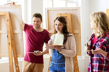 Image showing group of young artists painting at art school