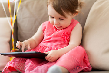 Image showing baby girl with tablet pc at home