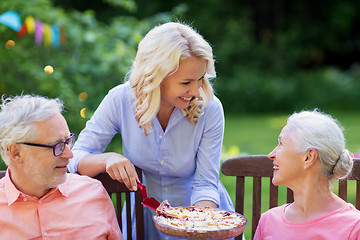 Image showing happy family having dinner or summer garden party