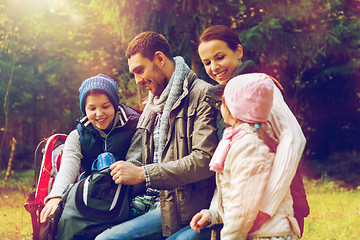 Image showing happy family drinking hot tea at camp