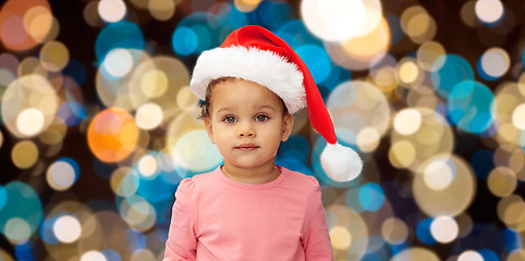 Image showing little baby girl in santa hat at christmas