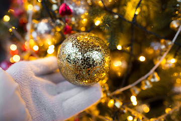 Image showing close up of hand with christmas tree toy