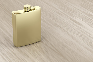 Image showing Golden hip flask