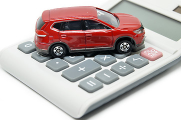 Image showing Calculator and toy car