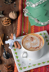 Image showing Cup of coffee and Christmas decorations