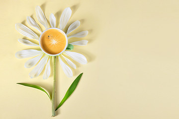 Image showing Cup of coffee and petals create flower