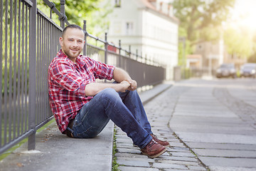 Image showing bearded handsome man relaxing at the street