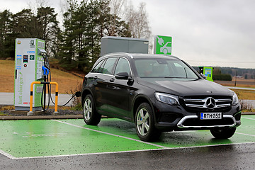 Image showing Mercedes-Benz Hybrid SUV Charging Battery