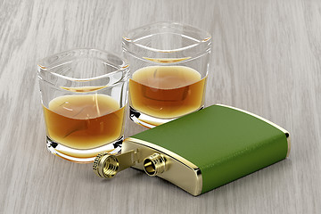 Image showing Green hip flask and glasses of whisky