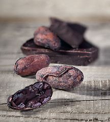 Image showing Cocoa beans and piece of dark chocolate