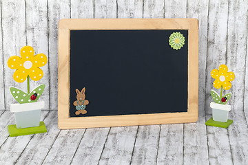 Image showing Blank Blackboard with decorative Flowers